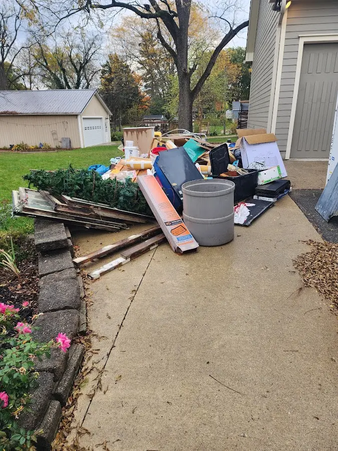 Dumpster being loaded with debris for Commercial Dumpster Rental in North Olmsted